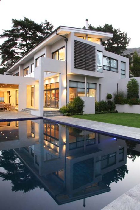 Reflections of overall home in the pool